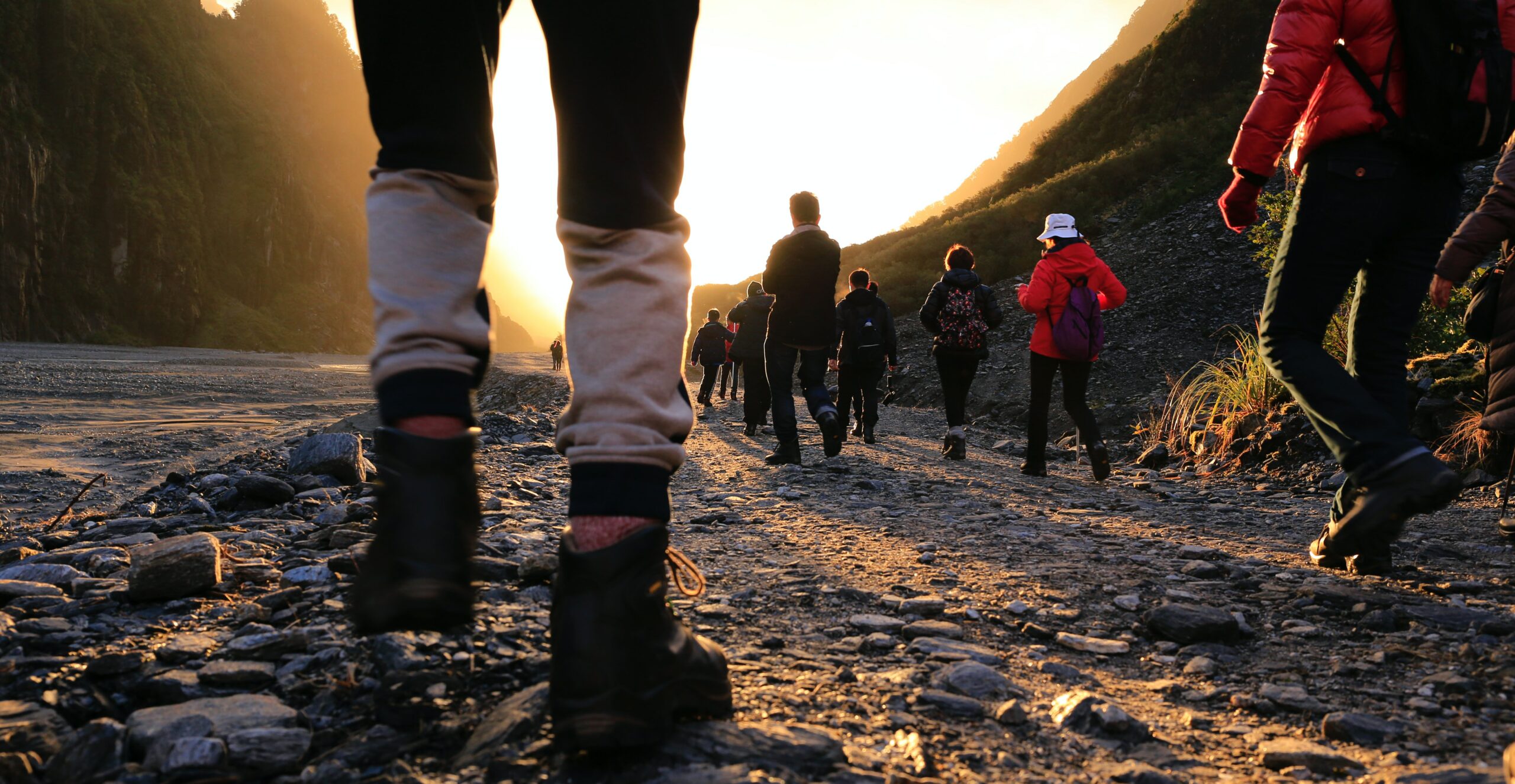 Hikers Walking along a Rocky Trail